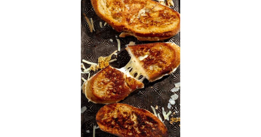 Grilled cheese sandwich with three separate sandwiches.