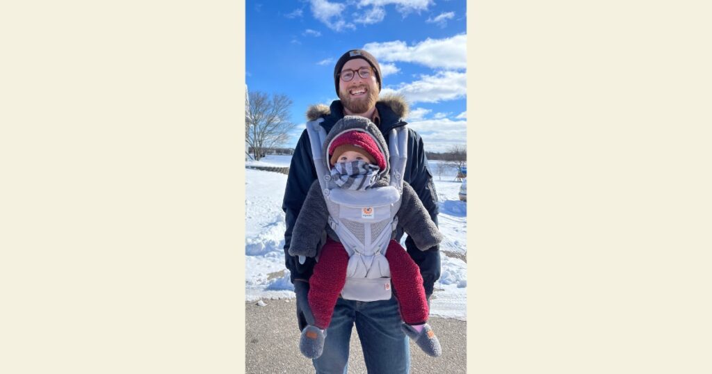 Dad baby wearing child forward facing