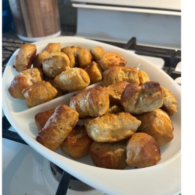 sourdough pretzel bites on a white dish.