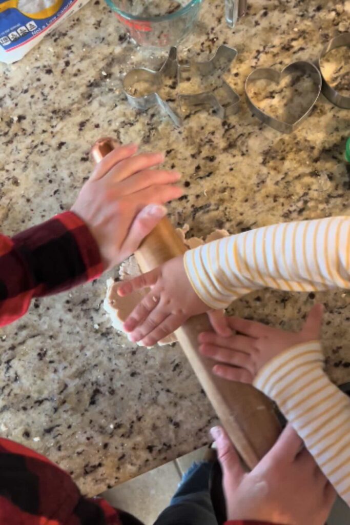 rolling out salt dough ornaments.