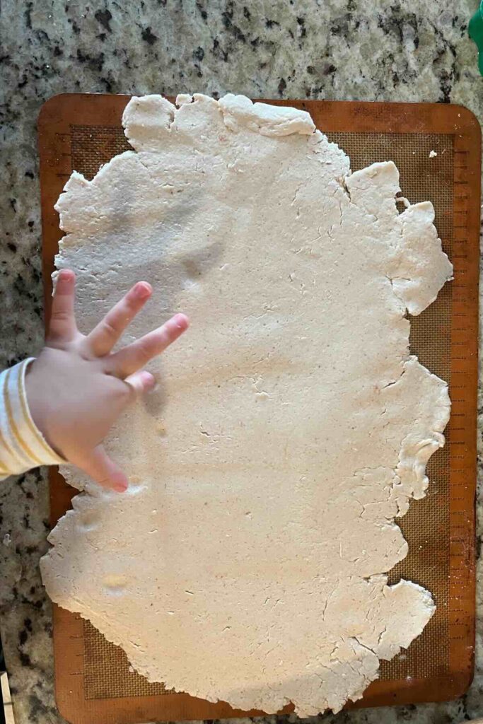 rolling out sourdough ornaments.