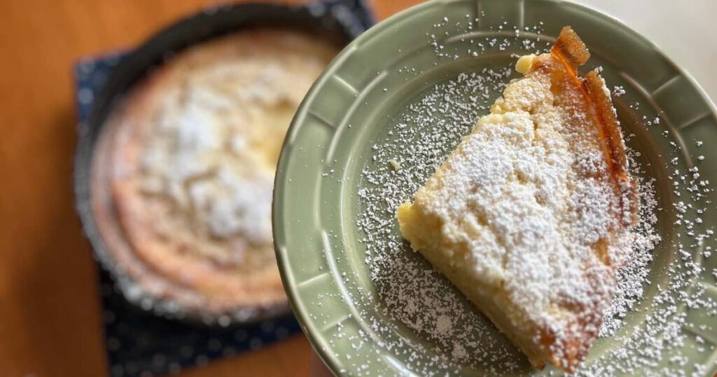 sourdough dutch baby slice in front of german pancake.
