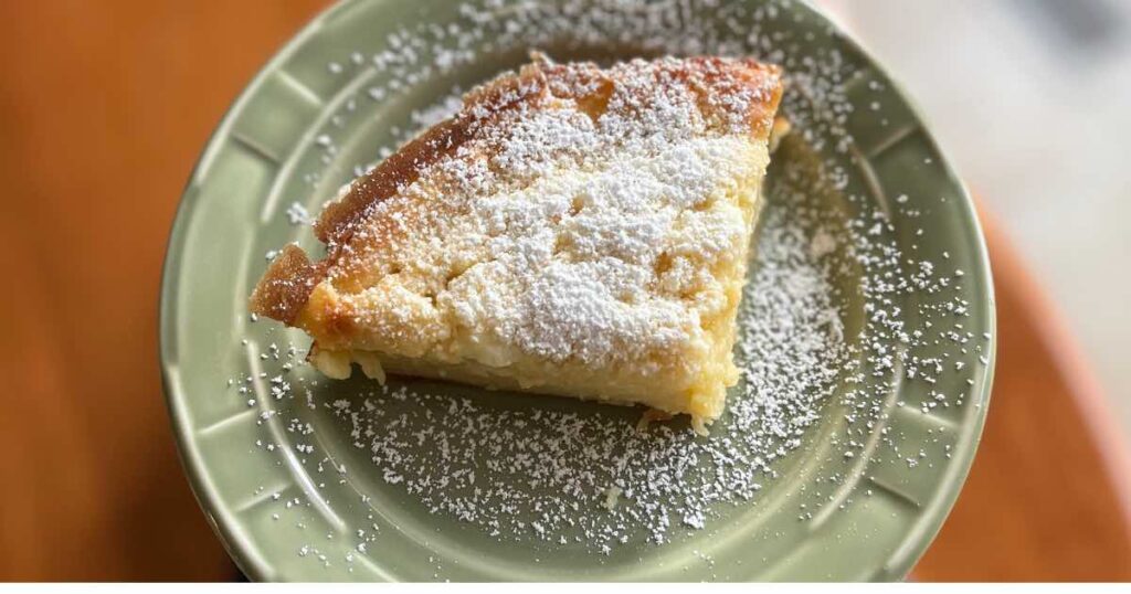 sourdough german pancake slice on green plate.