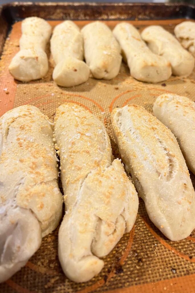 sourdough discard breadsticks on baking sheet.