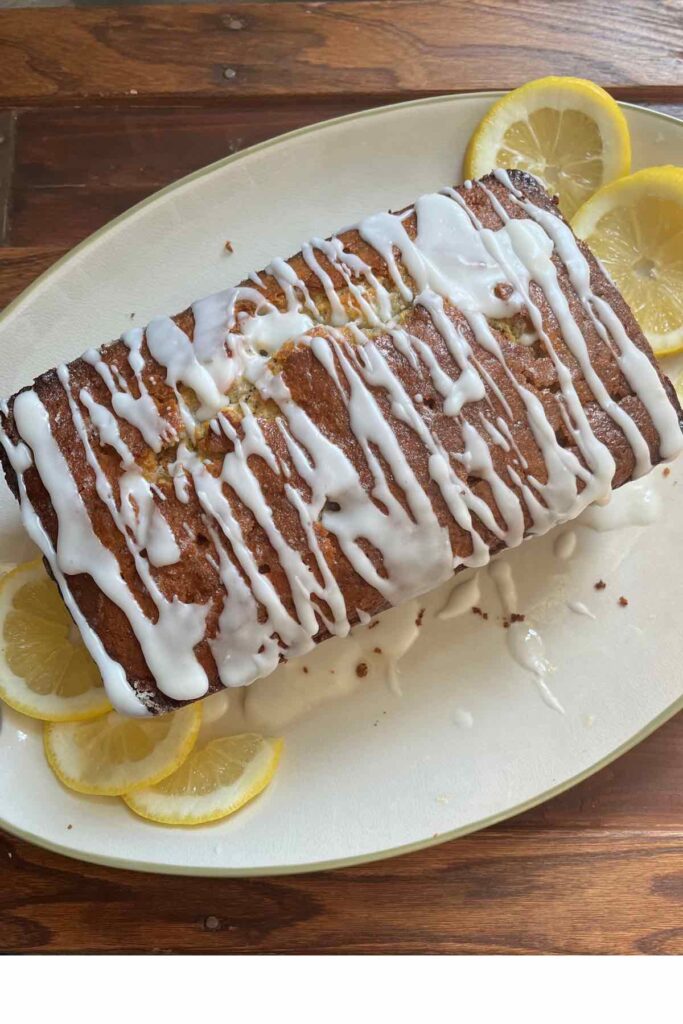 sourdough lemon yogurt loaf on brown wood.