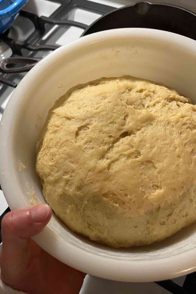 sourdough cinnamon roll dough in bowl.