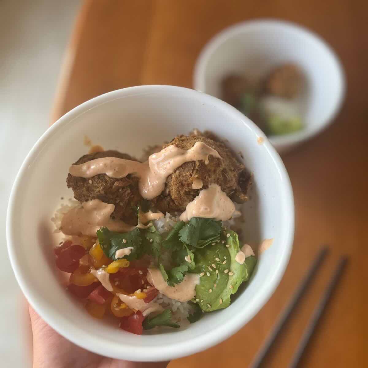 bowl of air fryer tuna cakes with cilantro, avocado and mayo.