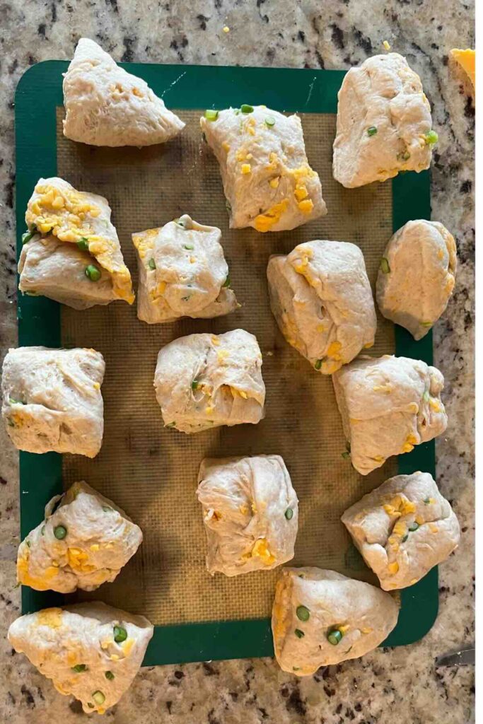 separated rolls on a baking sheet.