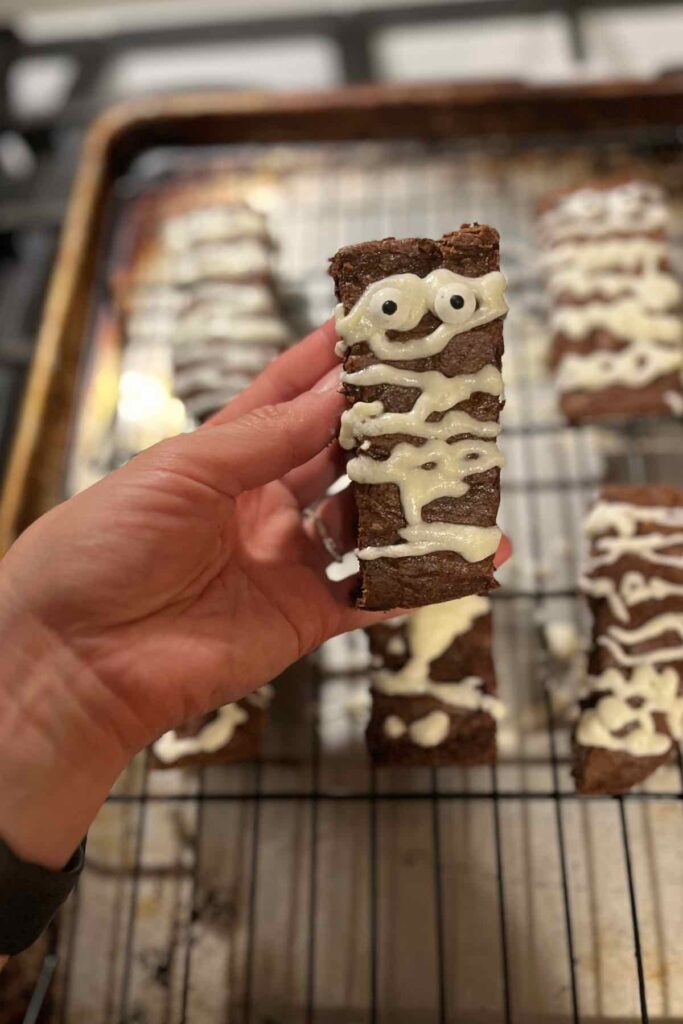 sourdough mummy brownie in front of more in background.