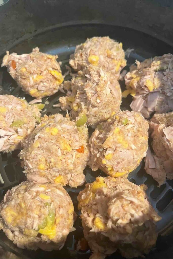 tuna balls in air fryer before being cooked.