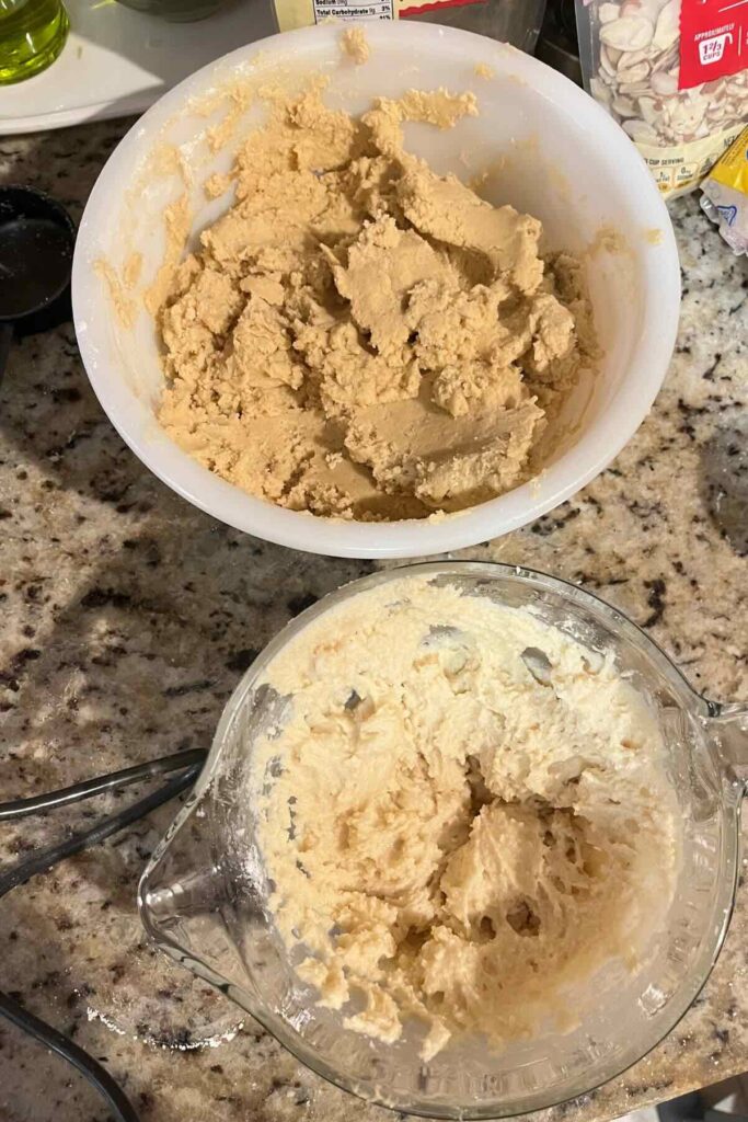 almond cookie dough and frangipane in mixing bowls.