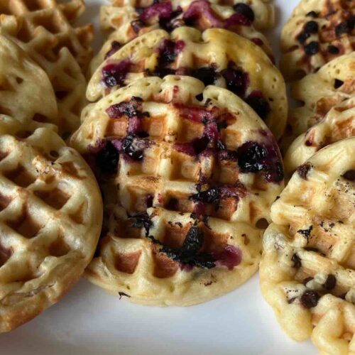 sourdough waffles on white plate.