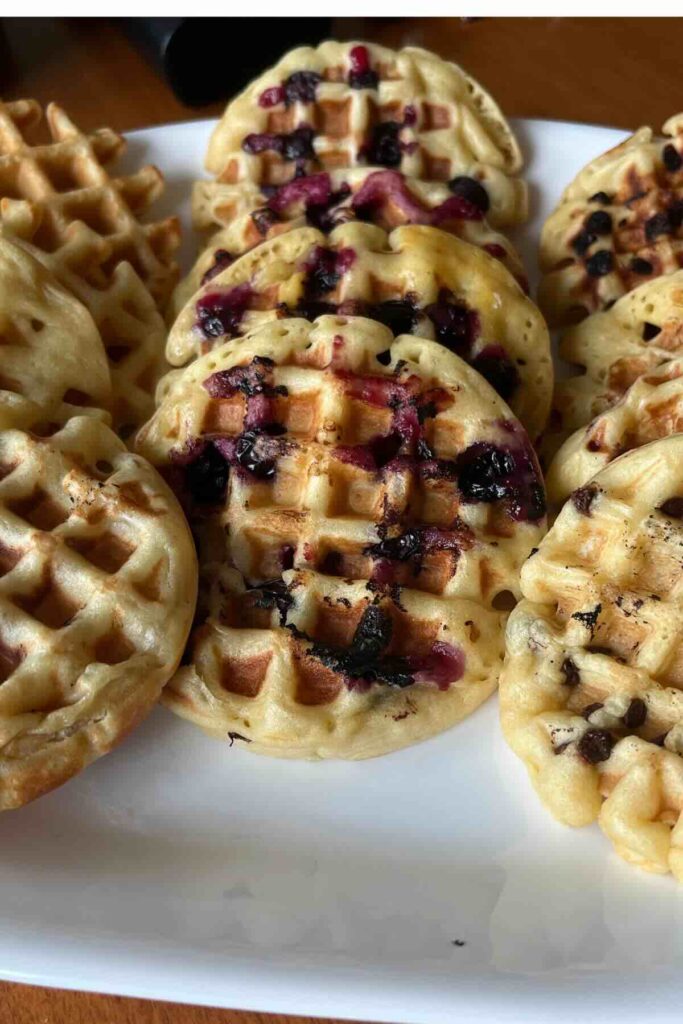 sourdough waffles on white plate.