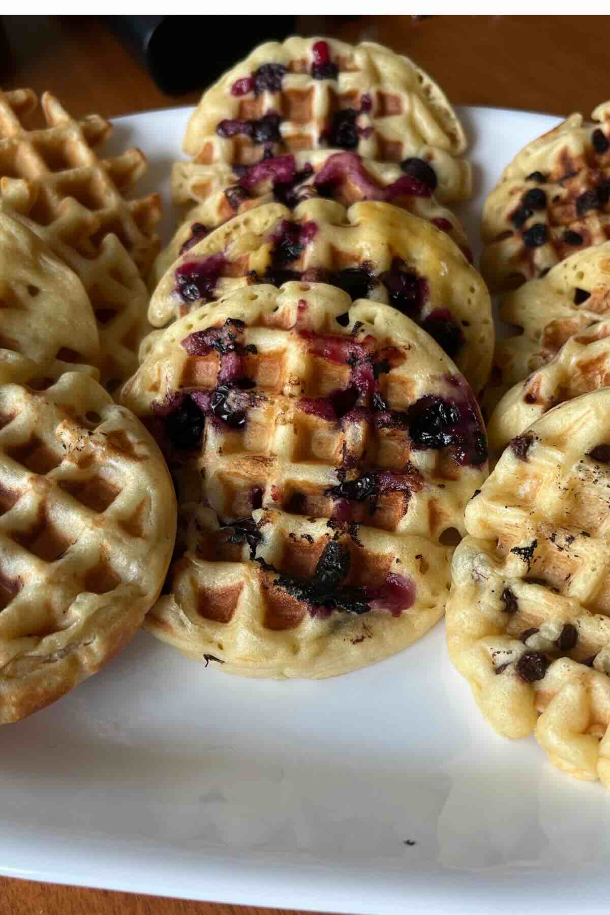 sourdough waffles on white plate.
