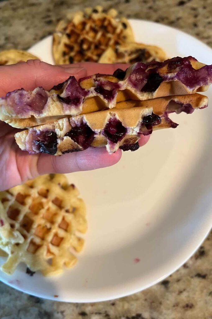 blueberry sourdough waffle split in half.