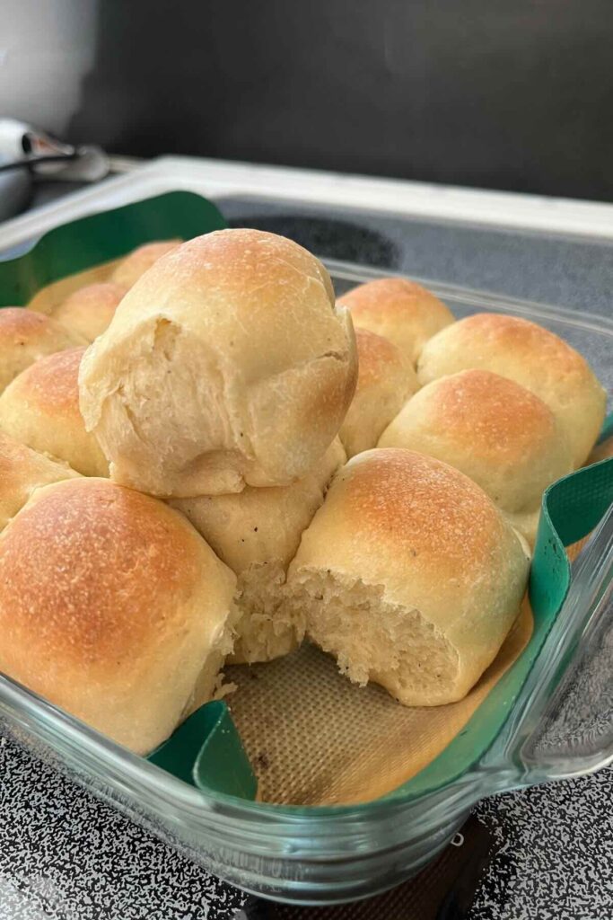 sourdough rosemary black pepper rolls in a pan.