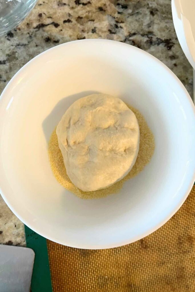 sourdough English muffin dunked in cornmeal.