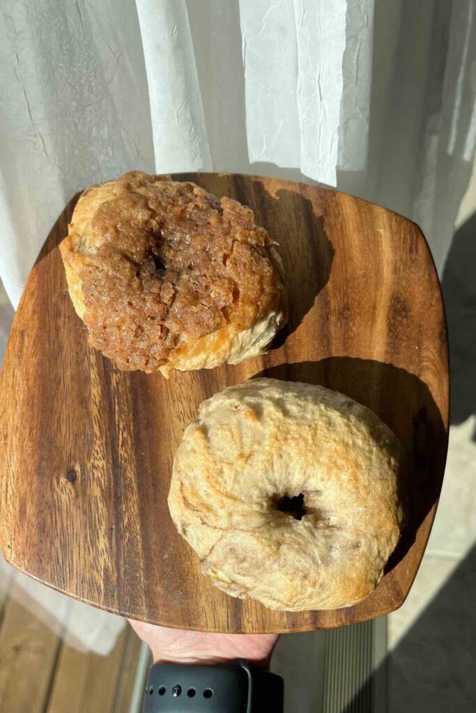 sourdough bagels on a cutting board.