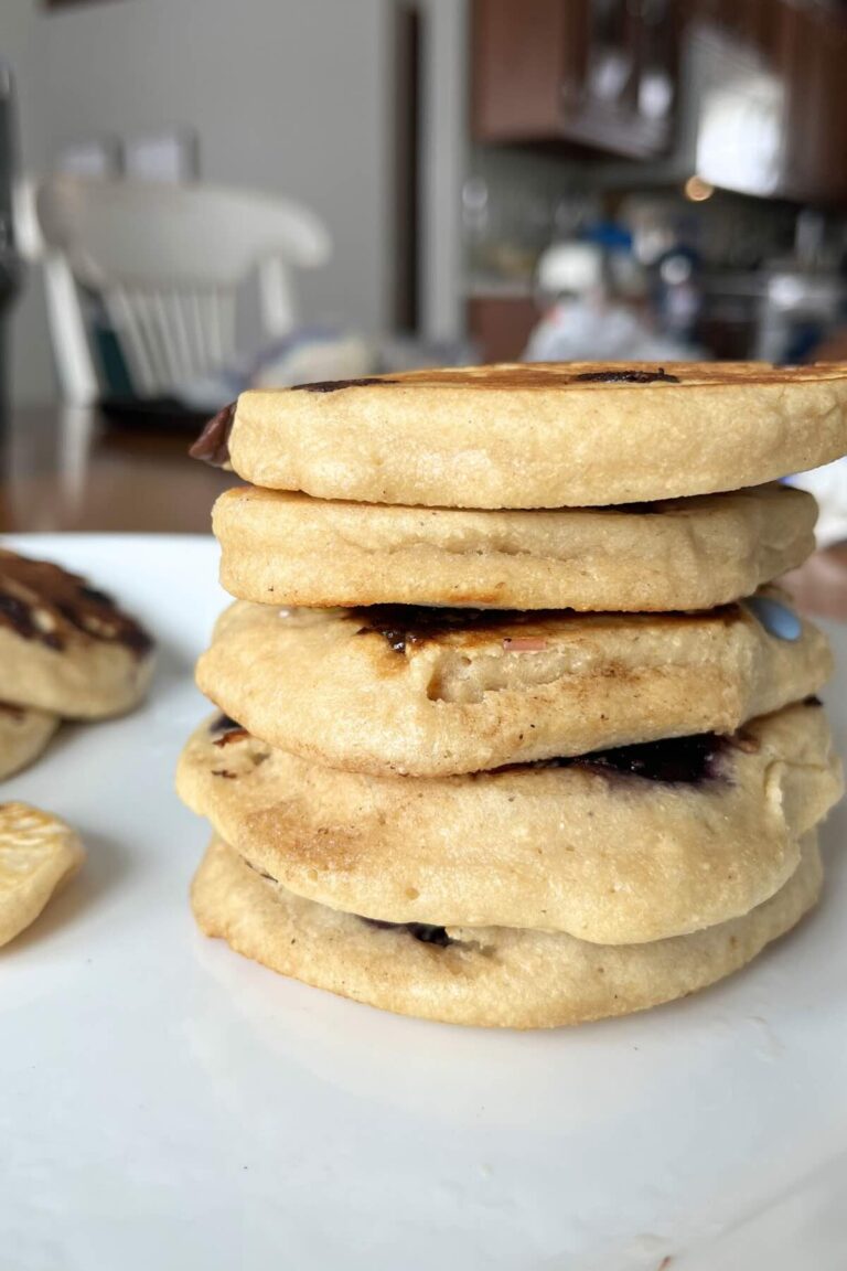 stack of freshly milled flour protein pancakes on a white plate.