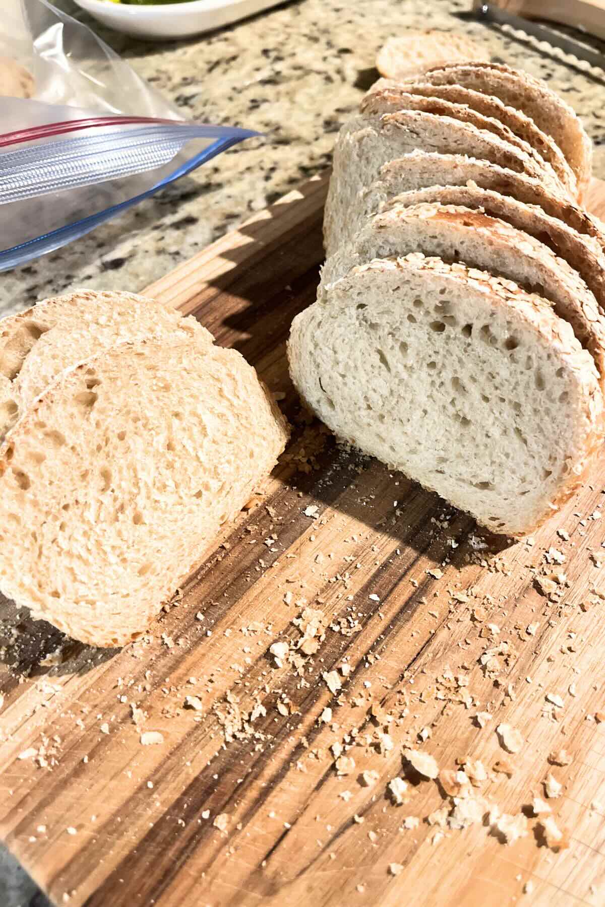 honey wheat sourdough bread on a wooden cutting board.