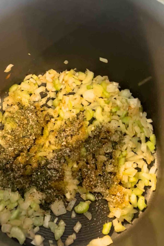 mirepoix and spices in a pot.