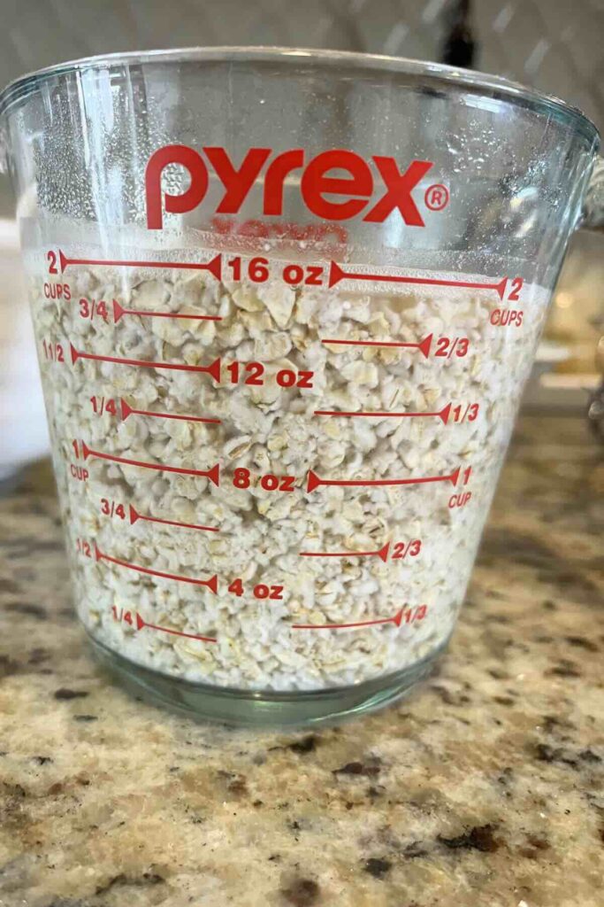 quick oats rehydrating in a glass container.