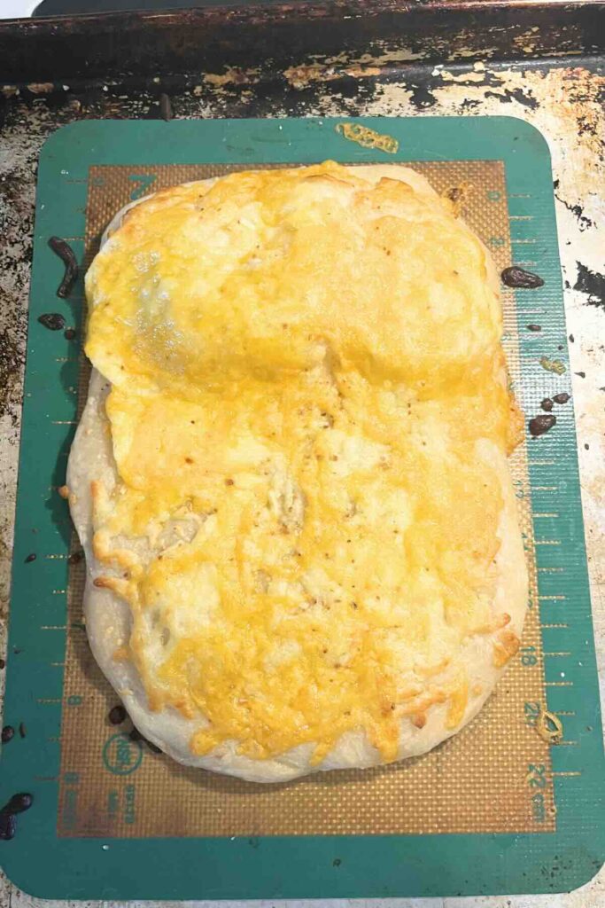sourdough cheese bread on a sheet pan.