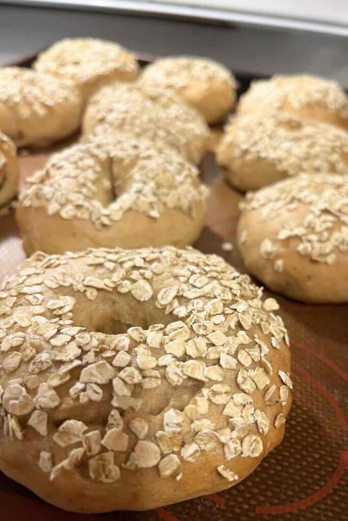 Honey oat bagel on sheet pan.