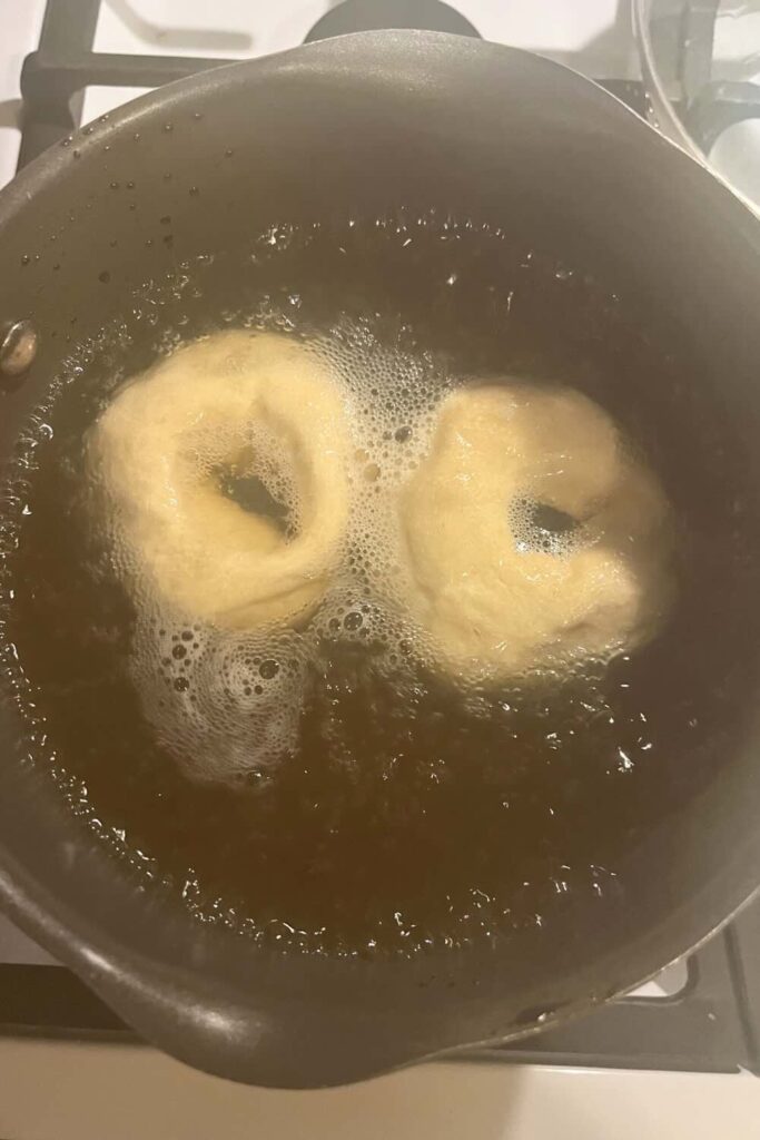 Boil bagels in water.