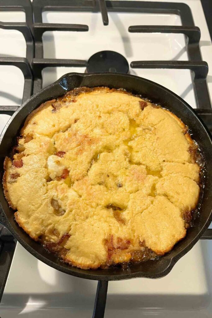 rhubarb sourdough dutch baby in cast iron skillet.