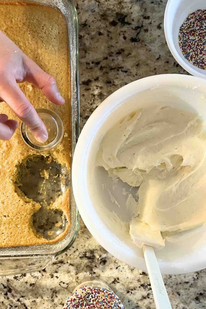 shaping vanilla bean cake into glass.