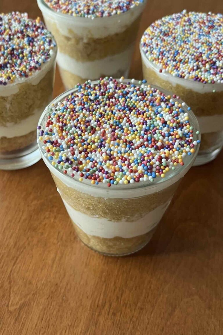 vanilla dot cake with four more behind it.
